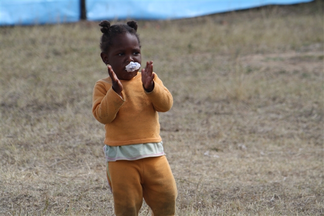 Young girl looks at the camera